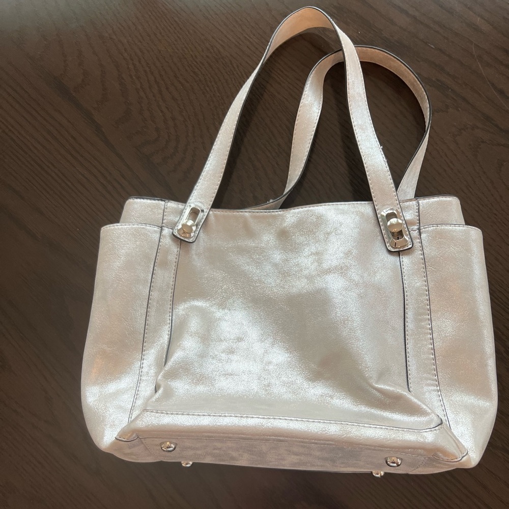 Cute silver bag with silver tone hardware.
